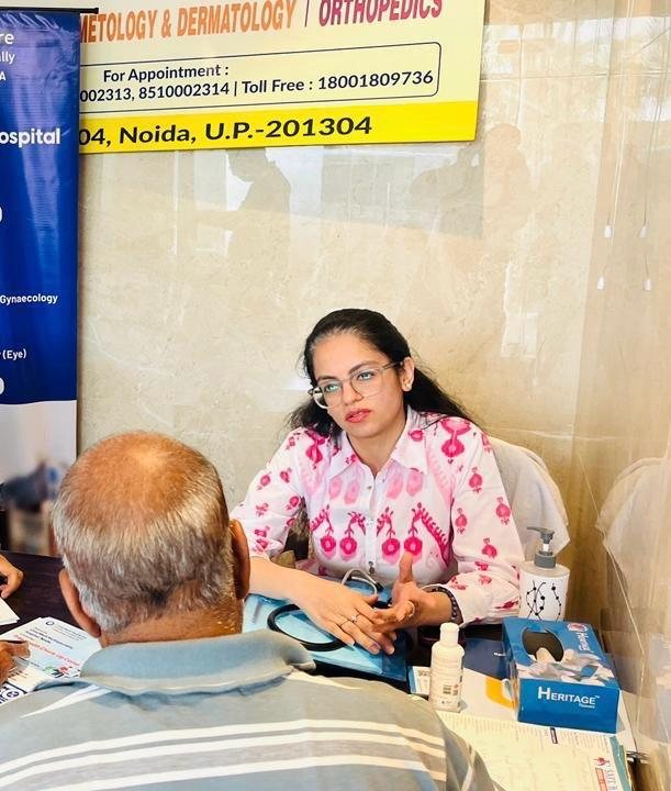 Dr. Ria consulting with a patient