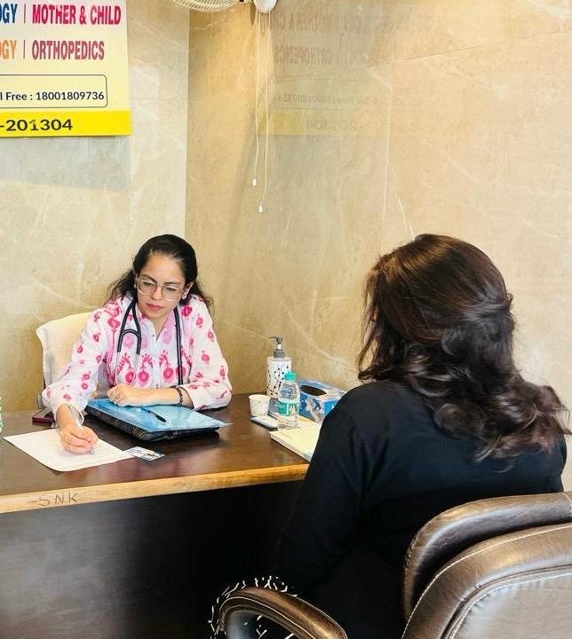 Dr. Ria Thukral Peetla noting down a patient's case history